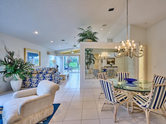 dining space featuring light tile patterned floors, ceiling fan with notable chandelier, a textured ceiling, and lofted ceiling