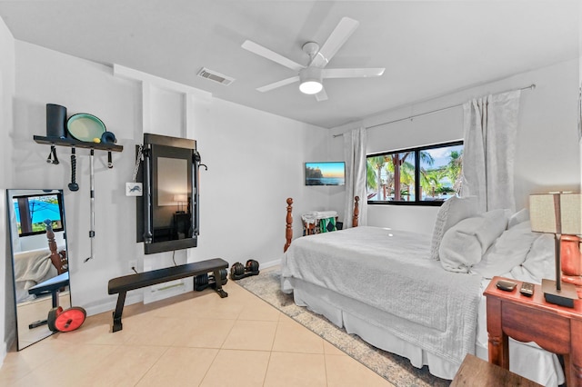 tiled bedroom featuring ceiling fan