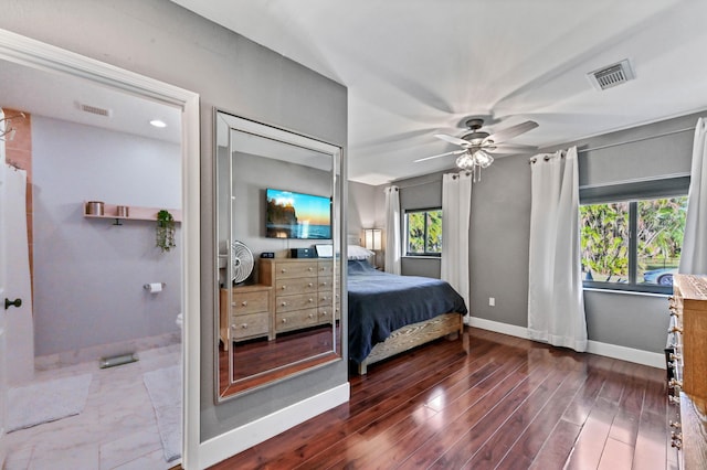 bedroom with dark hardwood / wood-style floors and ceiling fan