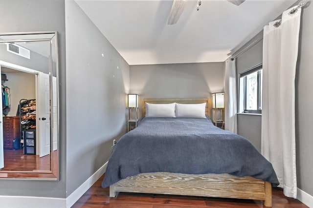 bedroom featuring dark hardwood / wood-style floors and ceiling fan