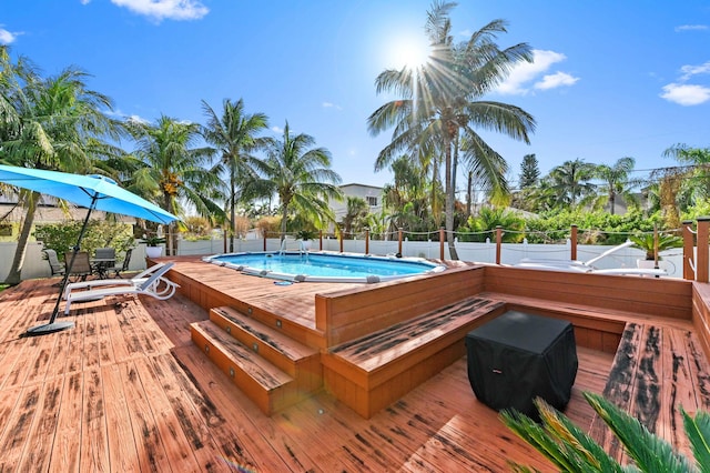 view of pool with a wooden deck