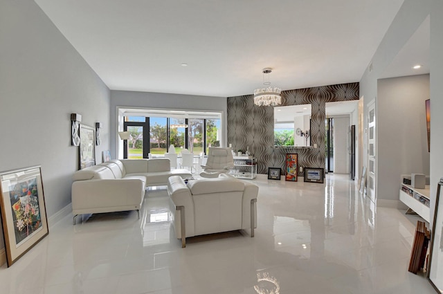 living room with french doors, light tile patterned floors, and a chandelier