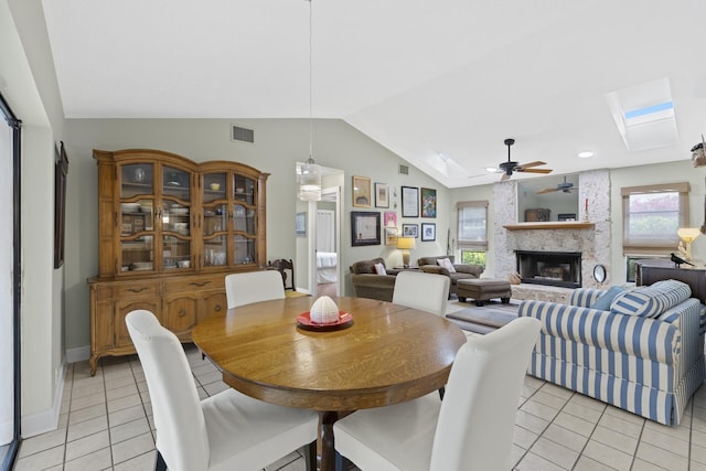 dining area with ceiling fan, plenty of natural light, and light tile patterned floors