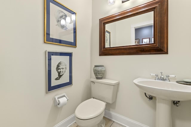 bathroom featuring tile patterned floors and toilet