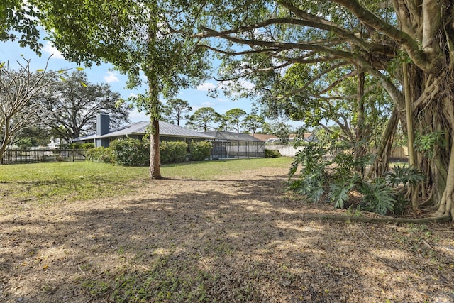 view of yard featuring a lanai