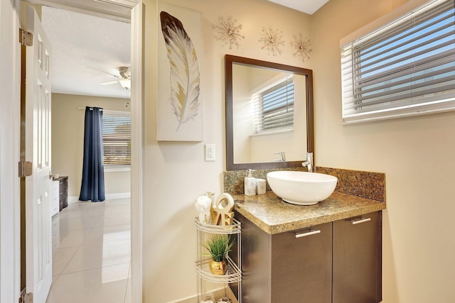 bathroom with ceiling fan, tile patterned flooring, and vanity