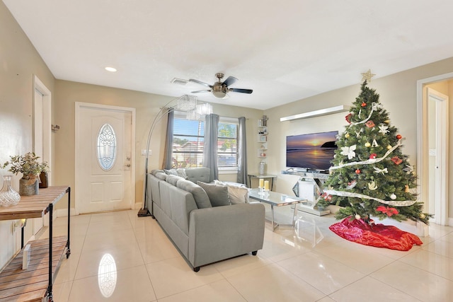 living room with ceiling fan and light tile patterned flooring