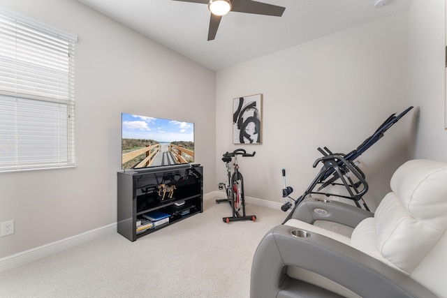 workout room with carpet floors and ceiling fan