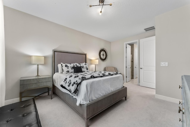 bedroom with light colored carpet