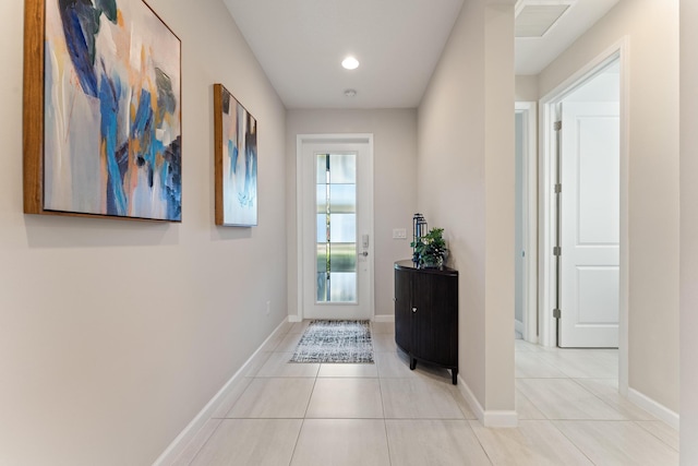 doorway with light tile patterned floors