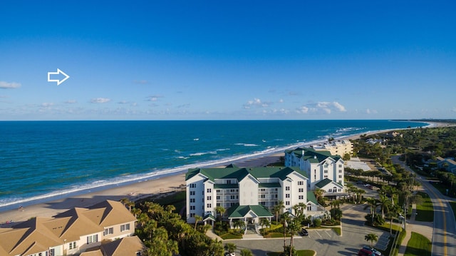 aerial view featuring a water view and a beach view