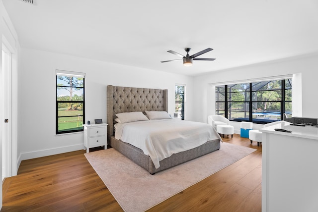 bedroom with hardwood / wood-style floors and ceiling fan