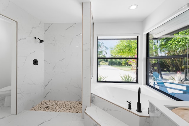 bathroom featuring plus walk in shower