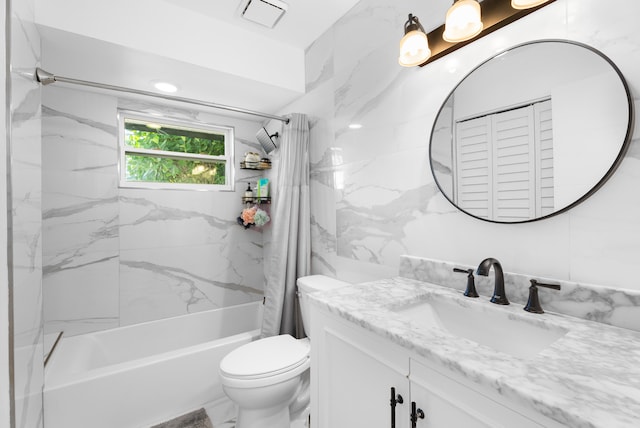 full bathroom featuring vanity, shower / tub combo with curtain, and toilet