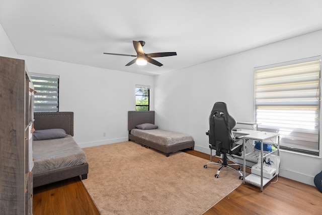 home office featuring ceiling fan and hardwood / wood-style floors