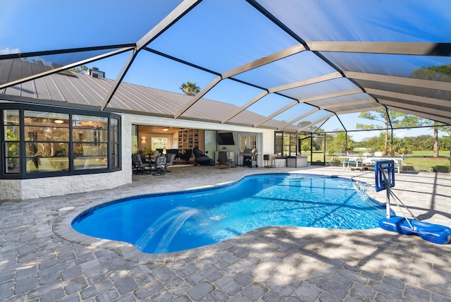 view of pool featuring a lanai and a patio area