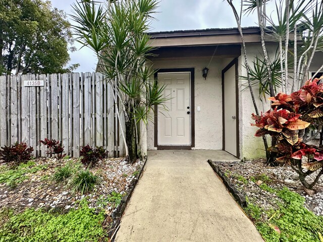 view of home's exterior with a lawn and central AC