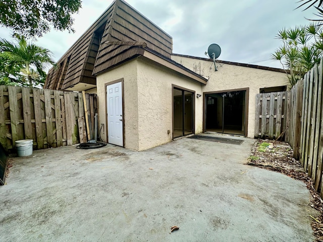 back of house featuring a patio area