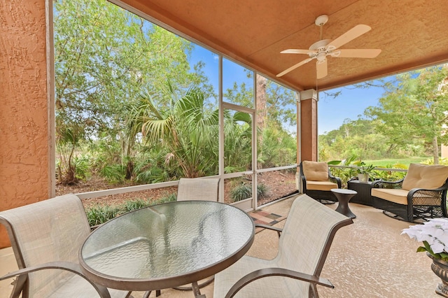 sunroom / solarium with ceiling fan