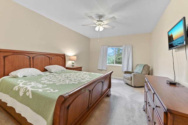 bedroom with ceiling fan and light carpet