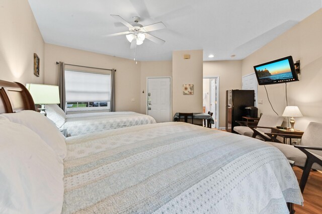 bedroom with ceiling fan and access to exterior