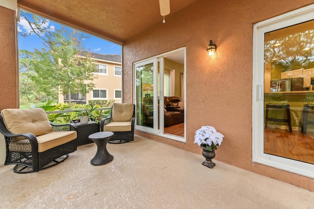 exterior space featuring a balcony and ceiling fan