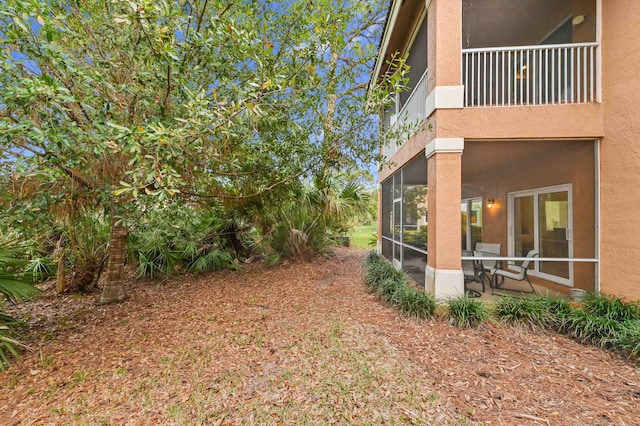 view of yard featuring a sunroom