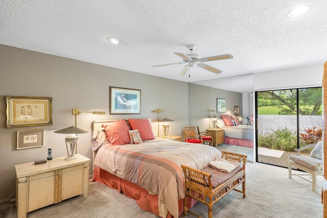 bedroom featuring access to outside, ceiling fan, light carpet, and a textured ceiling