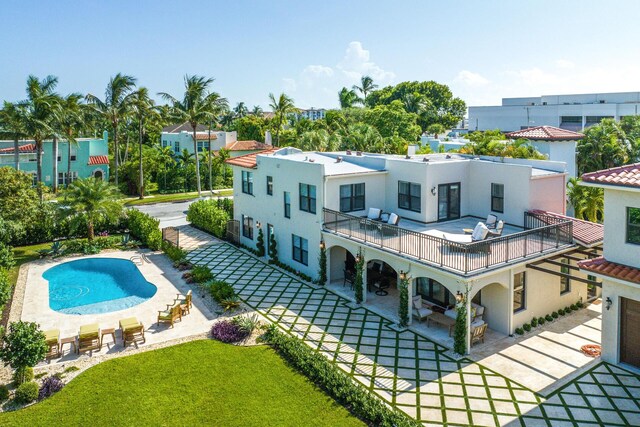 mediterranean / spanish-style house with a front yard