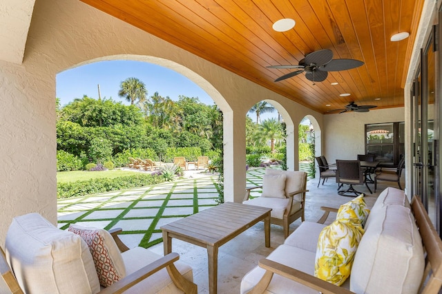 view of patio / terrace with an outdoor hangout area, ceiling fan, and outdoor dining area