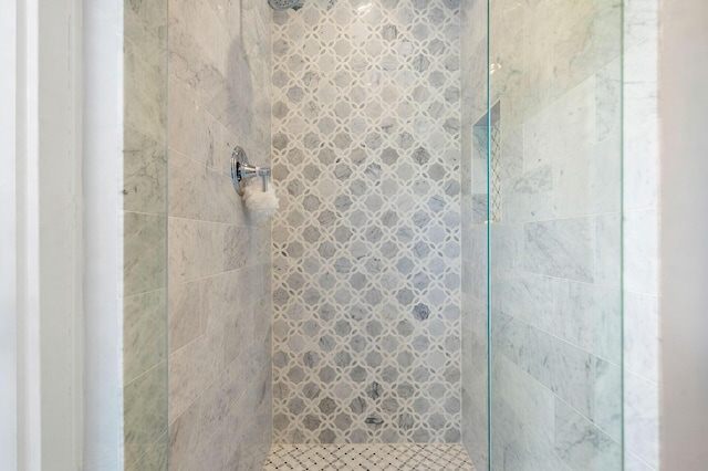 full bath with a shower stall