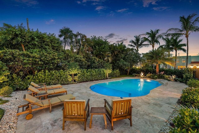 view of pool featuring a fenced in pool and a patio