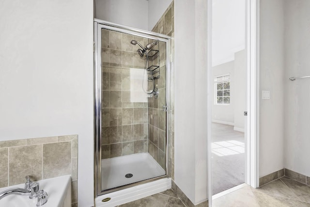 bathroom with tile patterned floors and separate shower and tub