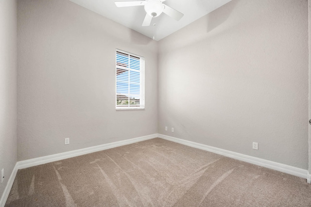 empty room with ceiling fan and carpet floors