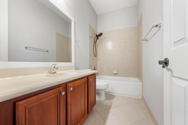 full bathroom with tile patterned flooring, vanity, toilet, and tiled shower / bath