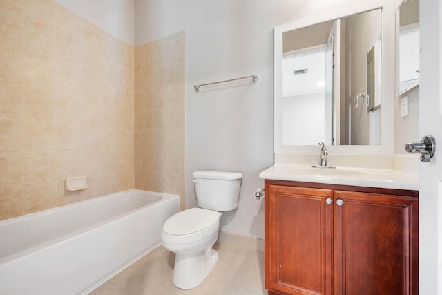 full bathroom featuring tile patterned floors, tiled shower / bath, vanity, and toilet