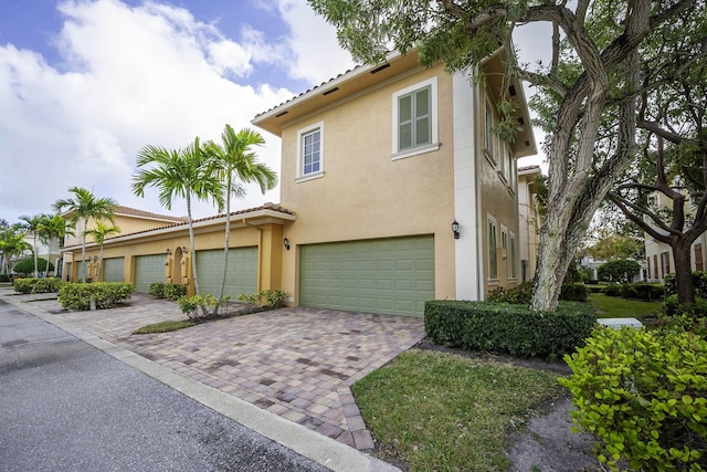 mediterranean / spanish-style house featuring a garage