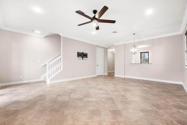 unfurnished living room with ceiling fan with notable chandelier and crown molding