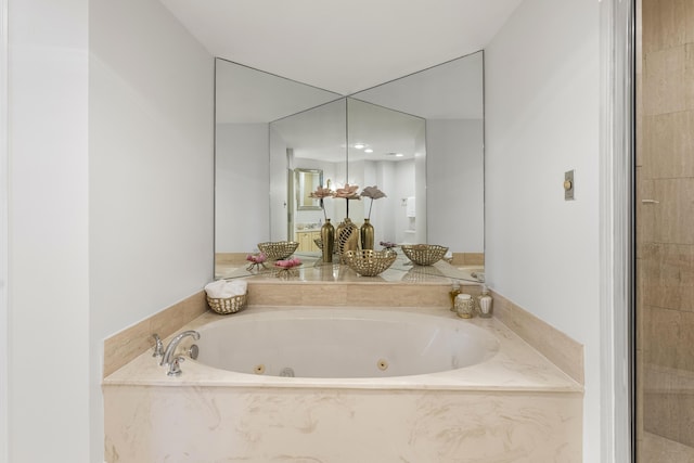 bathroom featuring a tub to relax in