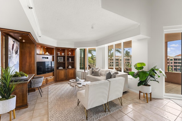 tiled living room with ornamental molding and a textured ceiling