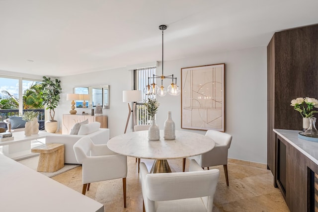 dining area featuring a notable chandelier