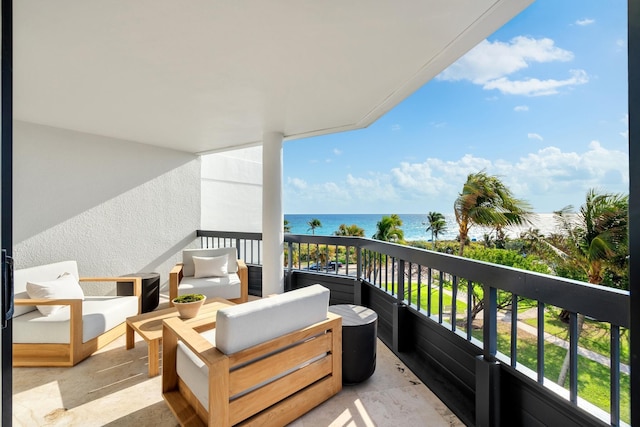 balcony featuring outdoor lounge area and a water view