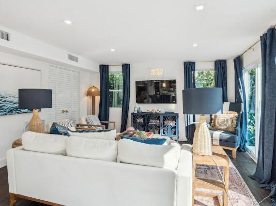 living room featuring dark wood-type flooring