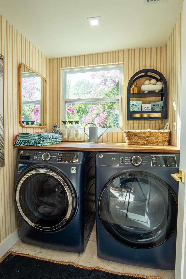 laundry room with independent washer and dryer