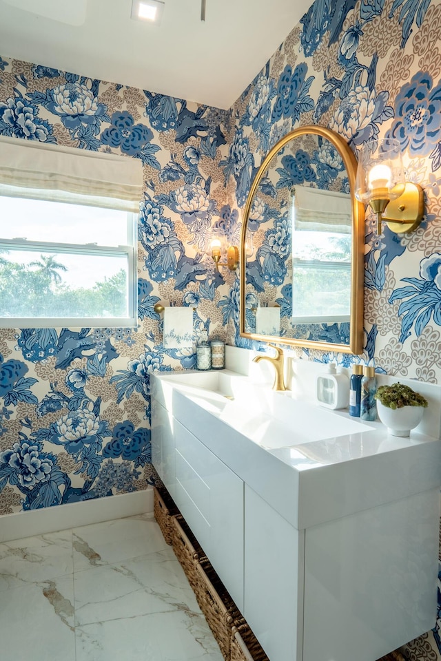 bathroom with vanity and a healthy amount of sunlight