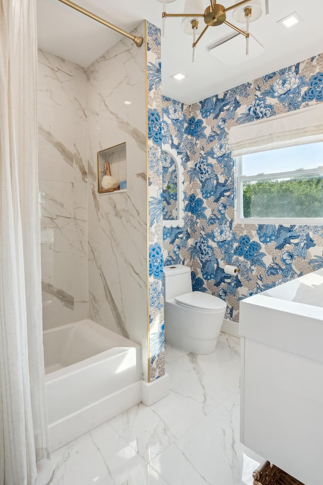 full bathroom with vanity, tiled shower / bath combo, a chandelier, and toilet