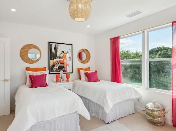 bedroom with light colored carpet