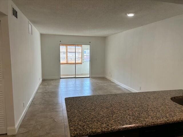 spare room with tile patterned flooring