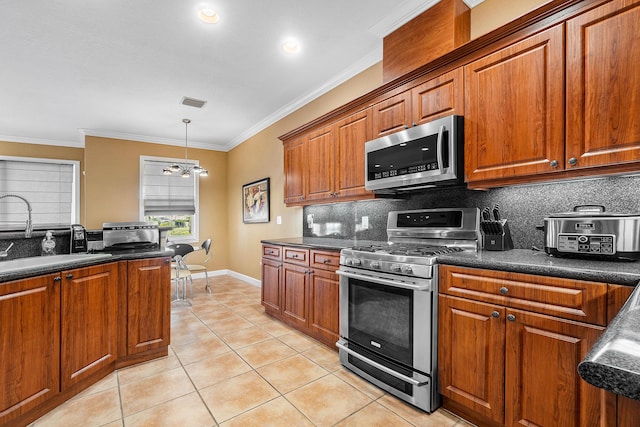 kitchen featuring crown molding, sink, light tile patterned floors, tasteful backsplash, and stainless steel appliances