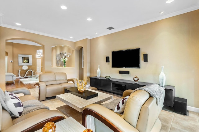 tiled living room featuring an inviting chandelier and ornamental molding